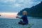 Children, enjoying sunset on Ersfjord Beach on Senja island, beautiful landscape view over the mountains