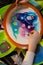 Children experiment with the colors in the dishes