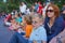 Children and families watching parade