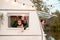 Children,family,brother sister traveling in camper,house on wheels. Trailer motor home.Looking in window. Funny road