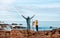 Children with father near the sea are happy with the rainbow. Co