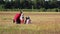 Children with the father spend time together in the field