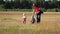 Children with the father spend time together in the field