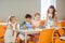 Children feeling busy while learning poem and eating lunch