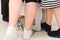 Children feet play at a party on a rug