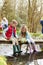 Children Fishing On Bridge At Outdoor Activity Centre