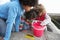 Children fishing for crabs