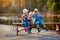 Children fishing with fishing rods. Warm autumn day. Fishing on a wooden pontoon