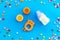 Children flat lay with toys and candy on blue background top view