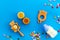 Children flat lay with toys and candy on blue background top view