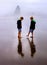 Children on Foggy Beach Vertical