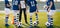 Children on Football Training. Young Footballers Listening Coach`s Pregame Speech