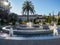 Children at the fountain. Streets of Batumi. Joyful weekend. Splashes of water from the fountain. City center. Place of attraction