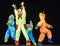 Children in funny colored overalls aliens dancing on stage