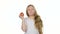 Children girl bites an apple and shows a thumbs up. White background