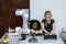 Children girl caucasoid and girl African American education electronic robotic arm on table at class room. learning innovation