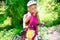 Children girl riding bicycle outdoor in forest