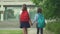 Children go back to school. Cute pupils with backpacks. Boy and girl in safety masks