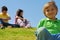 children on a grassy hill