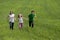 Children on green meadow field