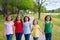 Children group of sisters girls and friends walking in park