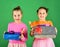 Children with happy faces pose with candies and presents