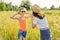 Children are having fun in nature, two girls laugh