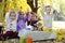 Children having fun on picnic under autumn leaves