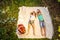 Children having a little picnic in summer garten with apples, spreading on white blanket.