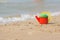 Children head left on shore of the beach near the water