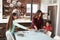 Children Helping To Lay Table Ready For Family Meal