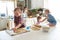 Children with her mother preparing cookies, large family. casua