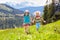 Children hiking in Alps mountains. Kids outdoor.