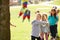 Children Hitting Pinata At Birthday Party