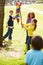 Children Hitting Pinata At Birthday Party