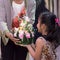 Children hold flora basket (Krathong)