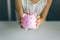 Children holds a piggy Bank. Concept of cash savings