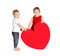 Children with huge heart made â€‹â€‹of red paper