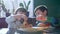 Children joy, hungry kids eat fast food during dinner in pizzeria restaurant in natural lighting