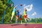 Children jump for flying ball during basketball