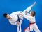 Children in karategi are training blocks and bumps