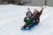 Children kids sledding toboggan sled snow winter