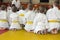 Children in kimono sitting on tatami on martial