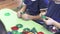 Children in kindergarten nursery school play with a multi-colored plastic construction kit. Hands close up