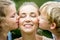 Children kissing mother with love