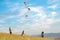 Children kite fighting with flying colorful kites - popular outdoor toy on the high grass mountain meadow. Happy childhood moments