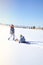 Children laughter have fun sledding on a sunny day on winter denver