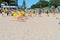 Children learning basics of fitness with Mount Maunganui Surf Life Saving Club on Main Beach on hot summer day