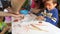 Children learning to shape plasticine