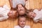 Children lie on the floor and looking at camera . portrait of brothers and sisters. red children